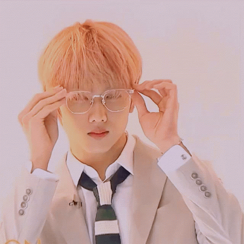 Man In Suit And Tie Adjusting Glasses GIF