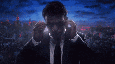 Man In Suit And Tie Adjusting Sunglasses GIF