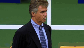 Man in Suit and Tie Against Green Wall