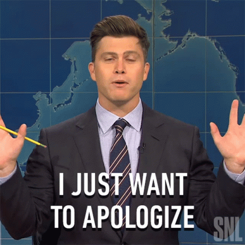 Man in Suit and Tie Apologizing
