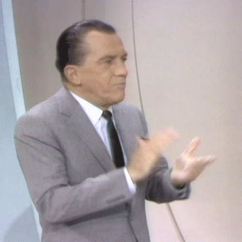 Man in Suit and Tie Applauding Hands Outstretched