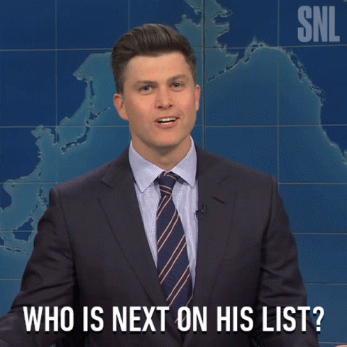 Man In Suit And Tie Asking Who Is Next GIF