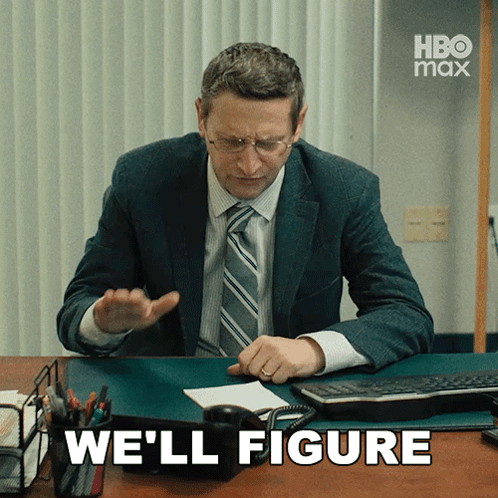 Man in Suit and Tie at Desk