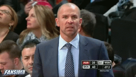 Man In Suit And Tie At Fansided Scoreboard GIF