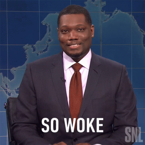 Man in Suit and Tie at Map Saying So Woke