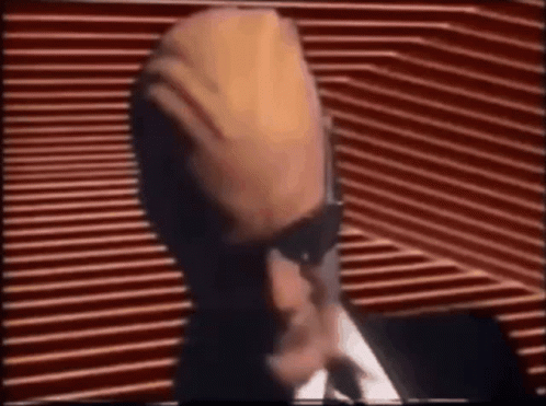 Man In Suit And Tie At Microphone GIF