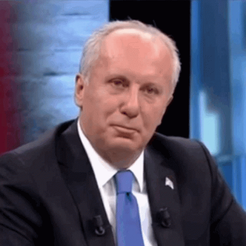 Man In Suit And Tie At Microphone GIF