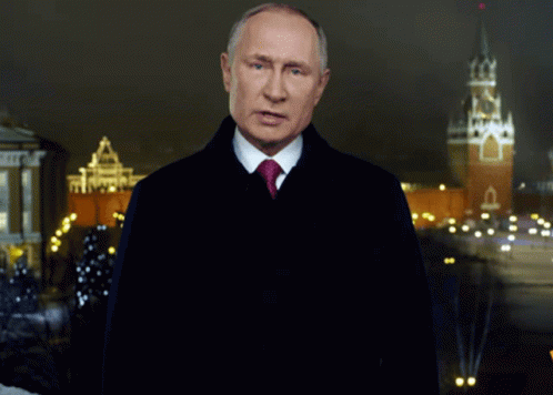 Man In Suit And Tie At Night Clock Tower GIF