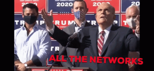 Man In Suit And Tie At Podium All The Networks GIF