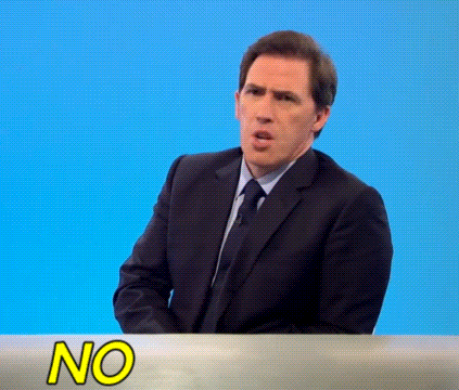 Man in Suit and Tie at Table with No Sign