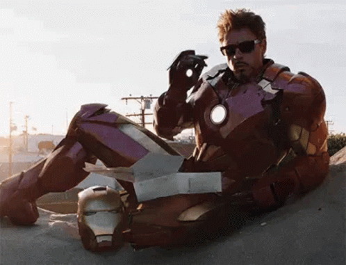 Man In Suit And Tie Before Avengers Sign GIF