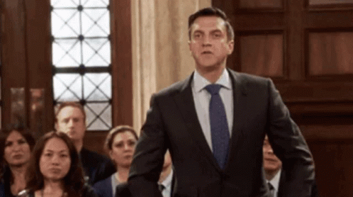 Man In Suit And Tie Before Crowd GIF