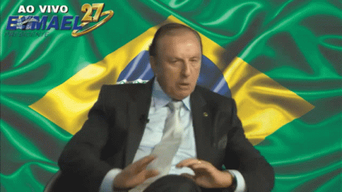 Man in Suit and Tie Before Flag Ao Vivo Emael 21
