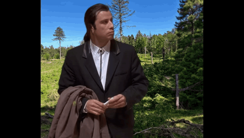 Man in Suit and Tie Before Forest