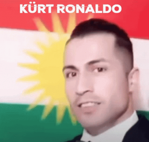 Man in Suit and Tie Before Kurdish Flag Kurt Ronaldo