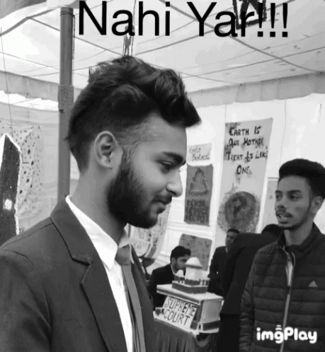 Man in Suit and Tie Before Sahi Court Sign