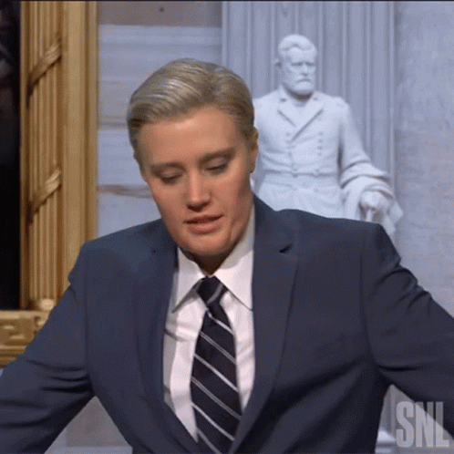 Man In Suit And Tie Before SNL Statue GIF