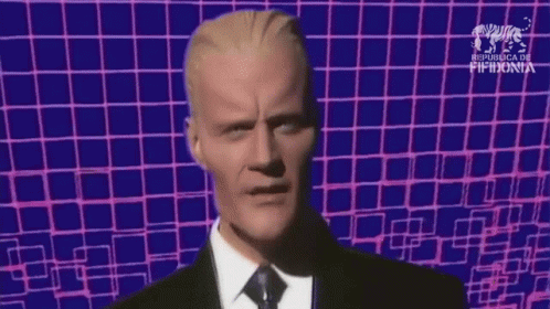 Man In Suit And Tie Blue Pink Checkered Background GIF
