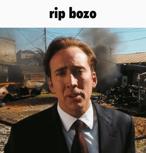 Man In Suit And Tie By Blue Wall 'Alaska 202 GIF
