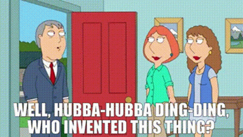 Man In Suit And Tie By Red Door With Two Women GIF