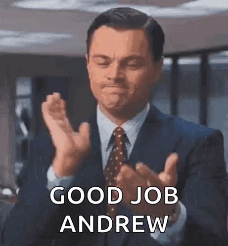 Man in Suit and Tie Clapping Good Job Andrew