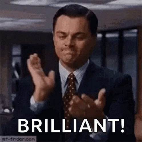 Man in Suit and Tie Clapping Hands