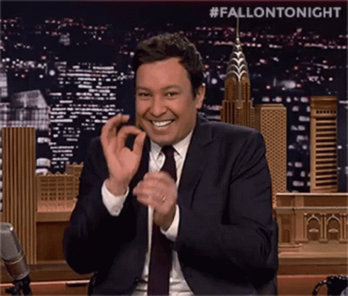 Man in Suit and Tie Clapping with City Skyline