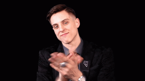Man in Suit and Tie Clapping