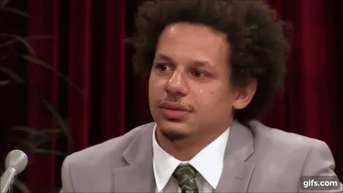 Man In Suit And Tie Crying At Microphone GIF