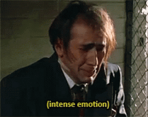Man in Suit and Tie Crying Intensely