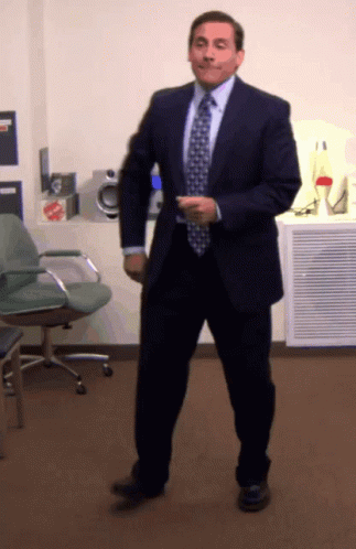 Man in Suit and Tie Dancing