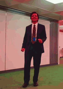 Man In Suit And Tie Dancing In Office GIF