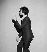 Man in Suit and Tie Dancing