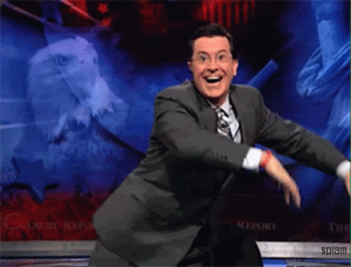 Man in Suit and Tie Dancing on Stage