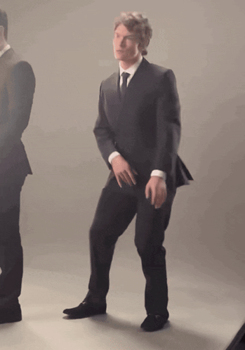 Man in Suit and Tie Dancing