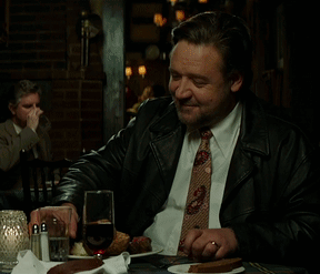 Man in Suit and Tie Drinking from Glass