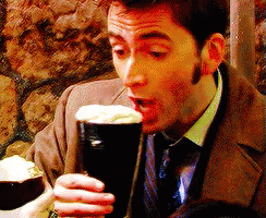 Man In Suit And Tie Drinking From Glass GIF