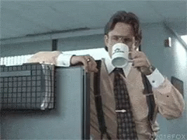 Man in Suit and Tie Drinking Mug Saying Fox