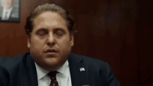 Man in Suit and Tie Eyes Closed