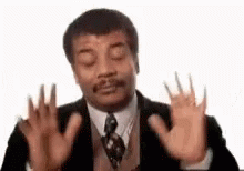 Man in Suit and Tie Funny Face with Hands Up