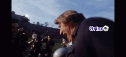 Man In Suit And Tie Giving High Five GIF