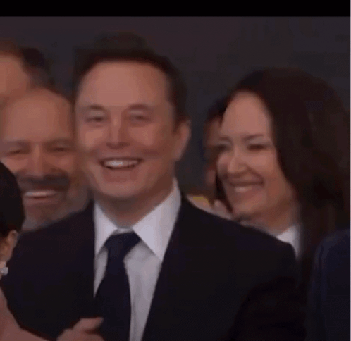 Man in Suit and Tie Giving Thumbs Up
