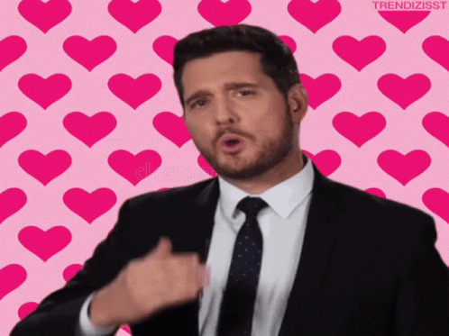 Man In Suit And Tie Giving Thumbs Up With Hearts GIF