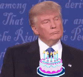 Man In Suit And Tie Holding Cake With Candles GIF