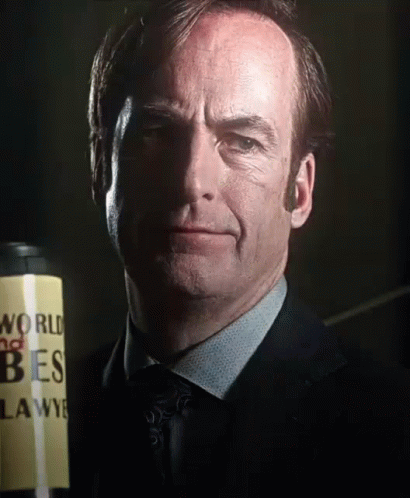 Man In Suit And Tie Holding Can Saying World No Tres GIF