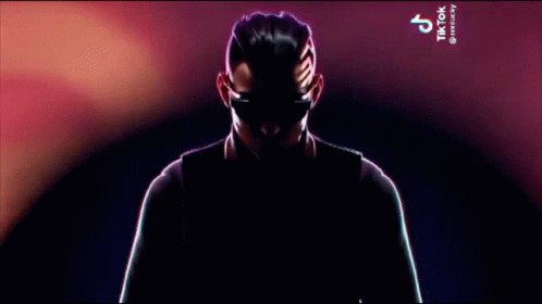 Man in Suit and Tie Holding Microphone With TikTok