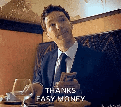Man in Suit and Tie Holding Money and Glass of Wine