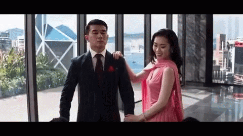 Man in Suit and Tie Holding Woman in Pink Dress