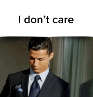 Man in Suit and Tie I Don't Care Sign