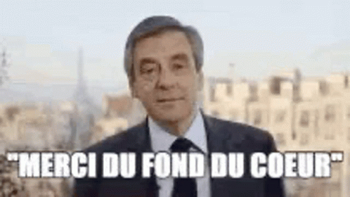 Man In Suit And Tie In City Says Merci Du Fond Du Coeur GIF